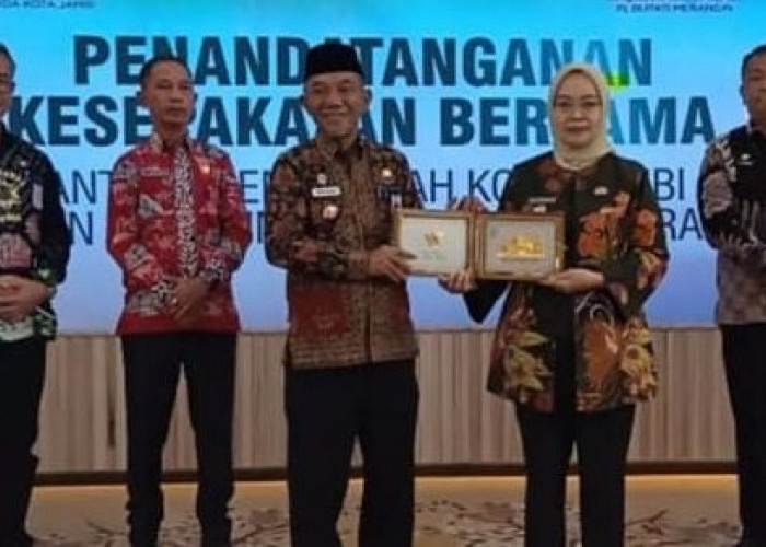 Pj Bupati Merangin Teken MoU dengan Pemkot Jambi